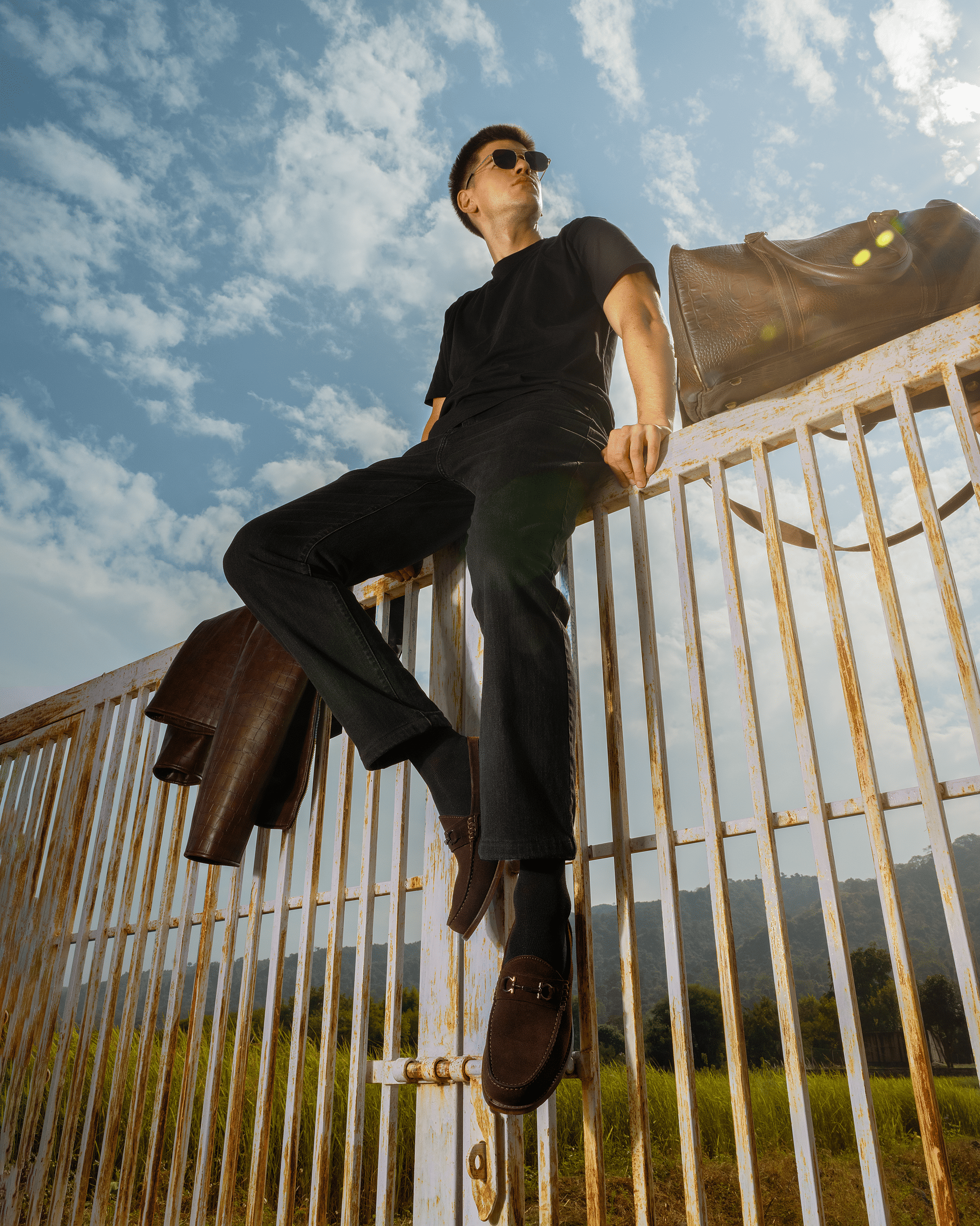 man wearing brown moccasin shoes