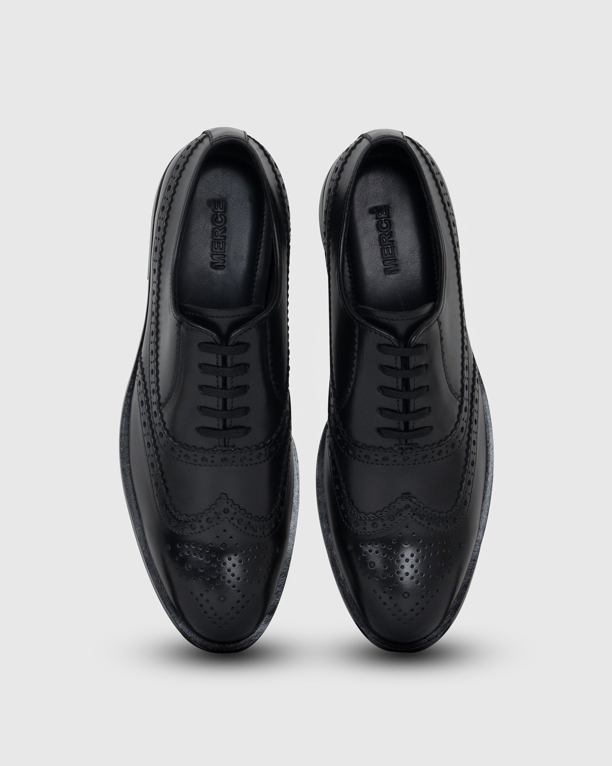 pair of black borgue shoes