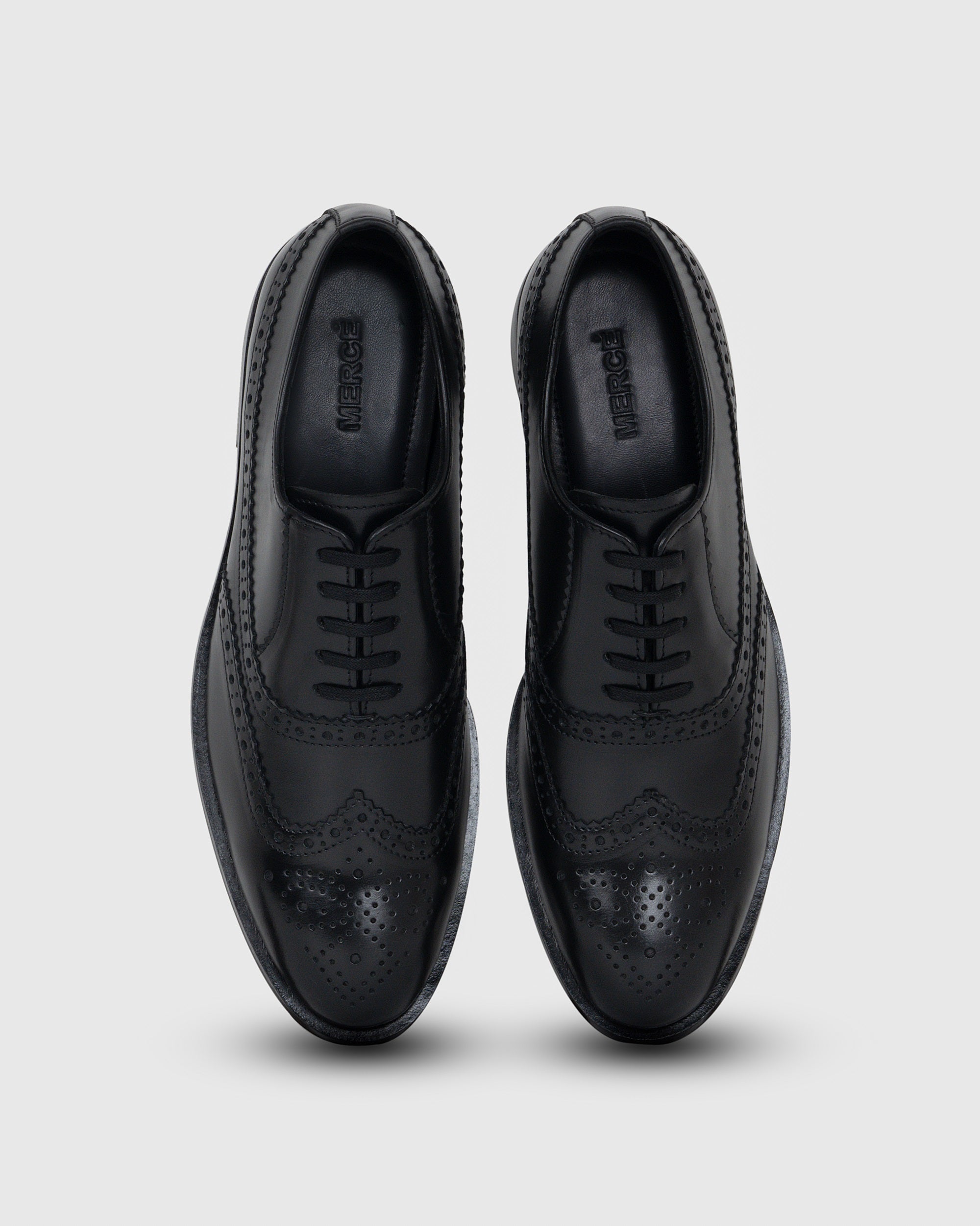 pair of black borgue shoes