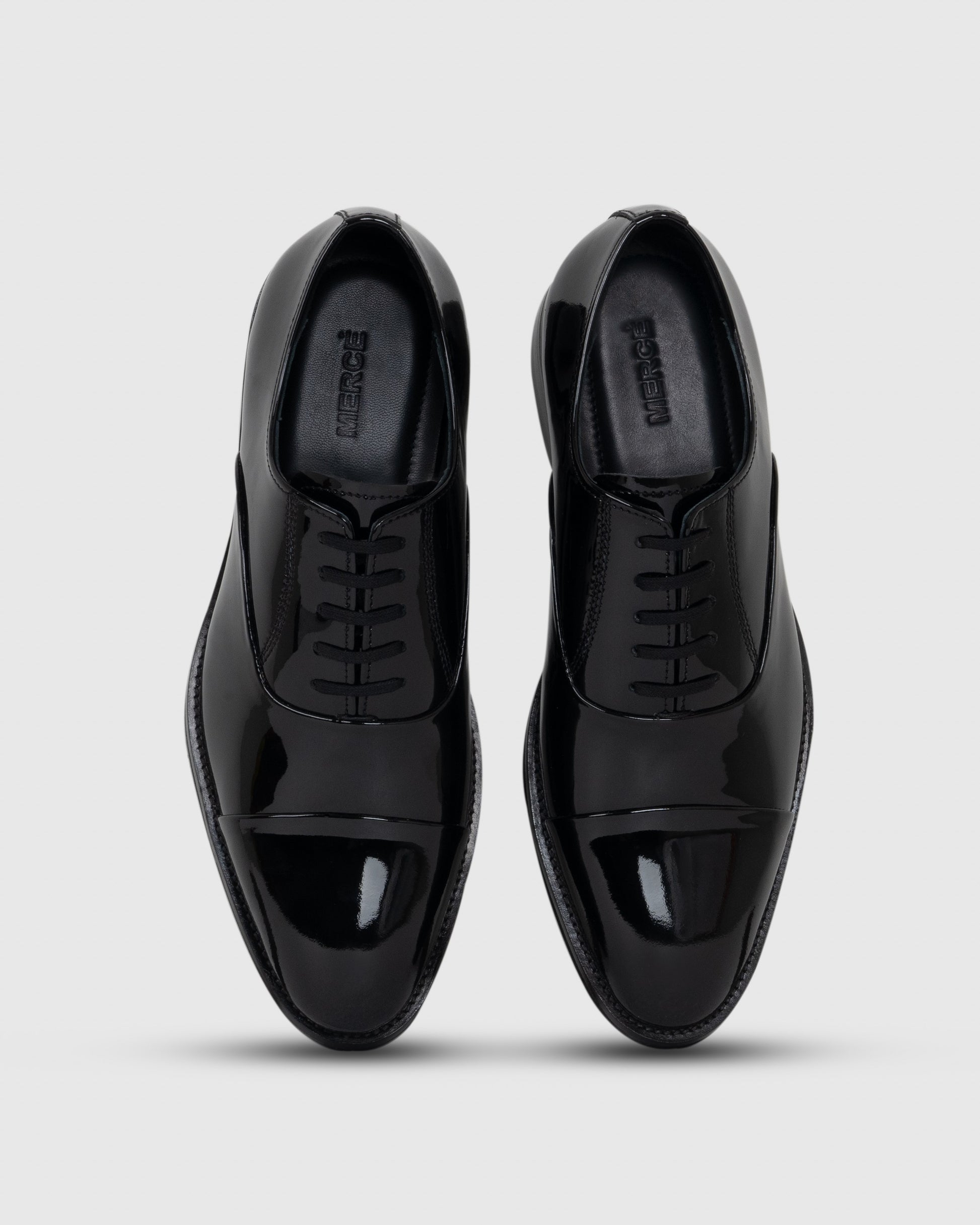 pair of black patent leather shoes